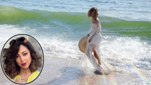 ما الذي جذب الجمهور في إطلالة بسمة بوسيل زوجة تامر حسني وهي على الشاطئ؟