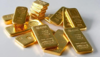 الذهب يهبط وسط تفاؤل بشأن التجارة وتعافي الدولار